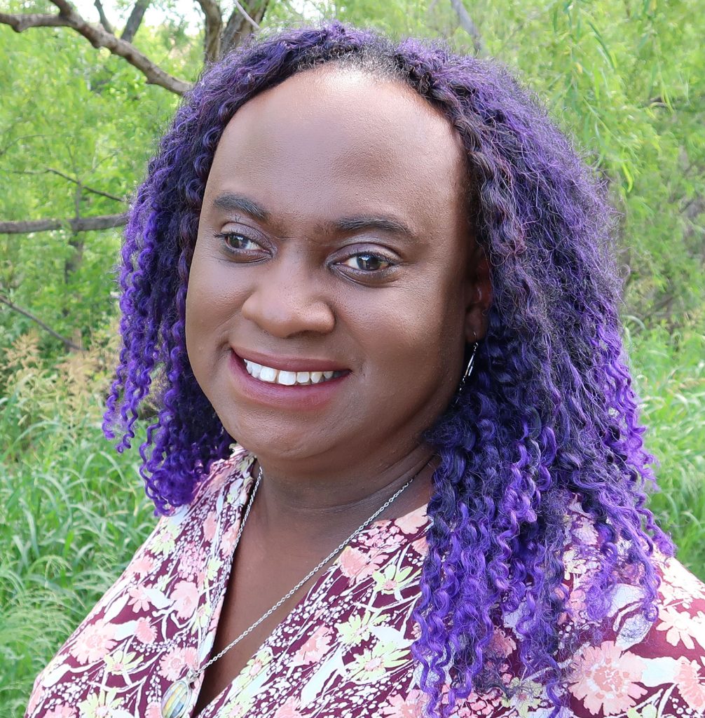 A headshot of Aubree Calvin (author). 