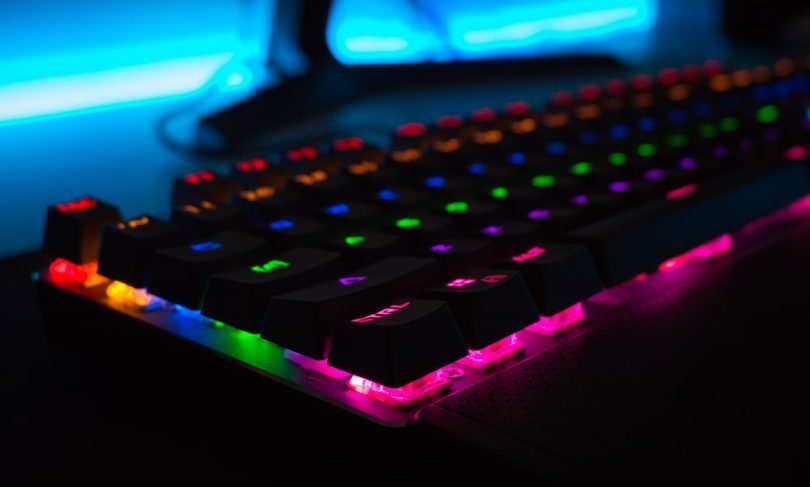 a close-up shot of a rainbow keyboard
